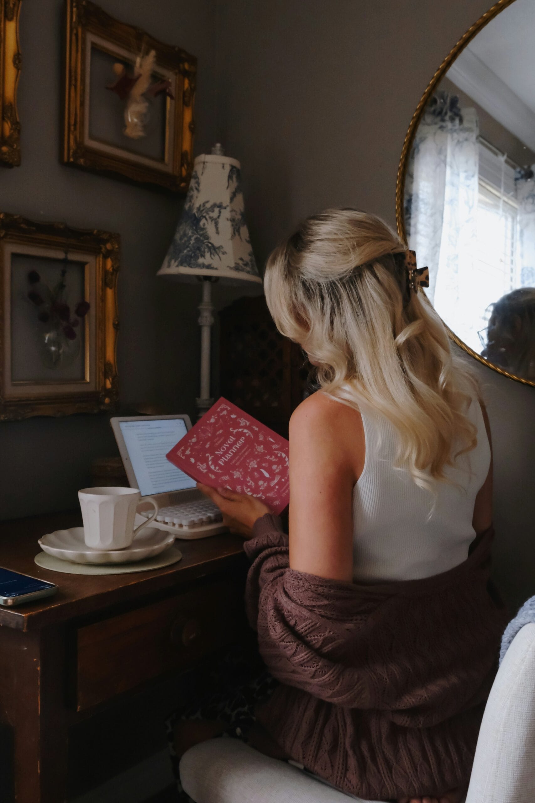 Exploring 'Where the Crawdads Sing': A Tale of Nature, Love, and Survival 4 a woman sitting in a chair holding a book scaled 1