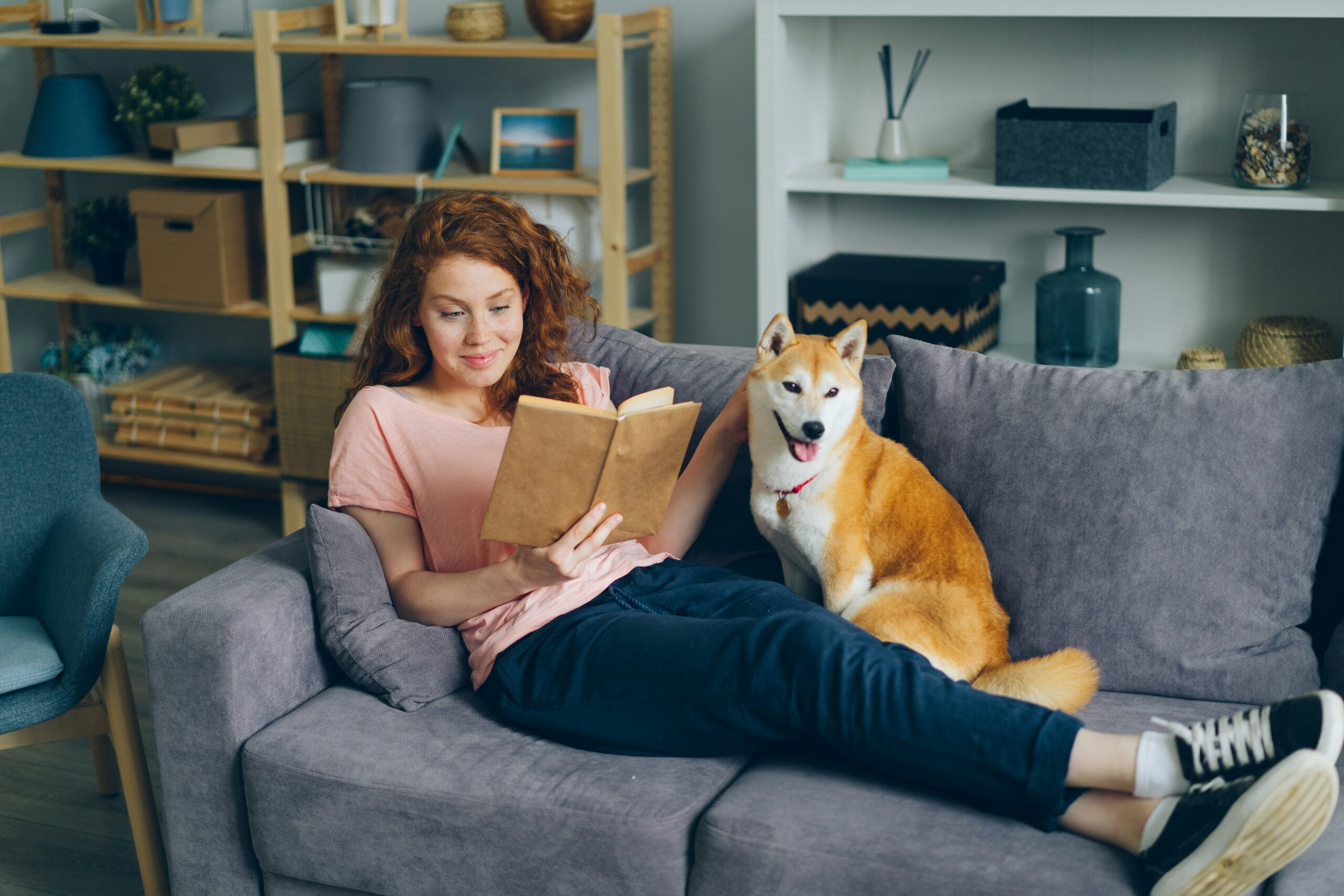 Eleanor Oliphant Is Completely Fine: Breaking Out of Isolation and Discovering Friendship 2 a woman sitting on a couch next to a dog