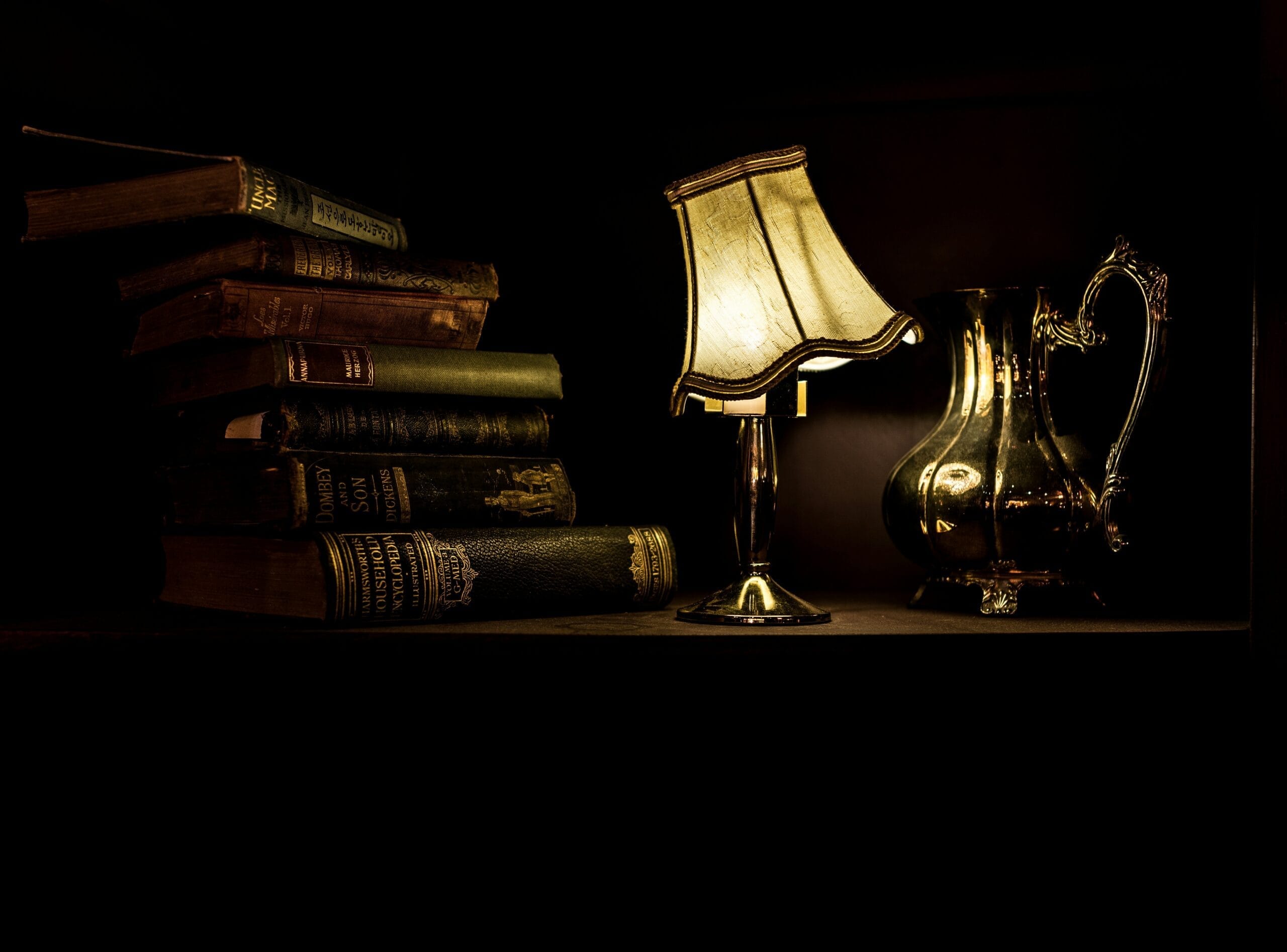 The Enchantment of Eastern European Folklore: Its Influence on Modern Fantasy Novels 10 turned on desk lamp beside pile of books